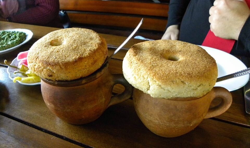 Traditionally, mchadi is served together with beans (lobio) in clay pots