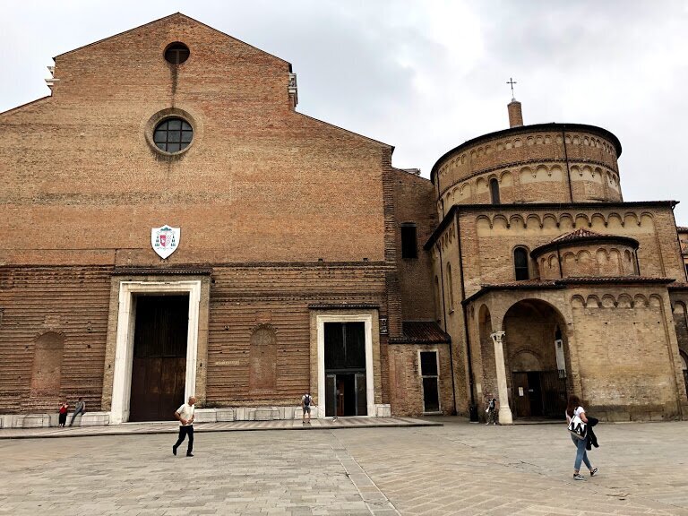 On the left is the Cathedral. On the right is the Baptistery with round turrets.