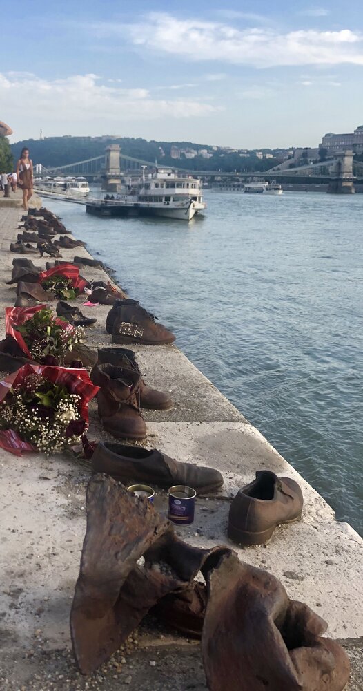 At any time of the year, there are flowers lying by the shoes on the promenade