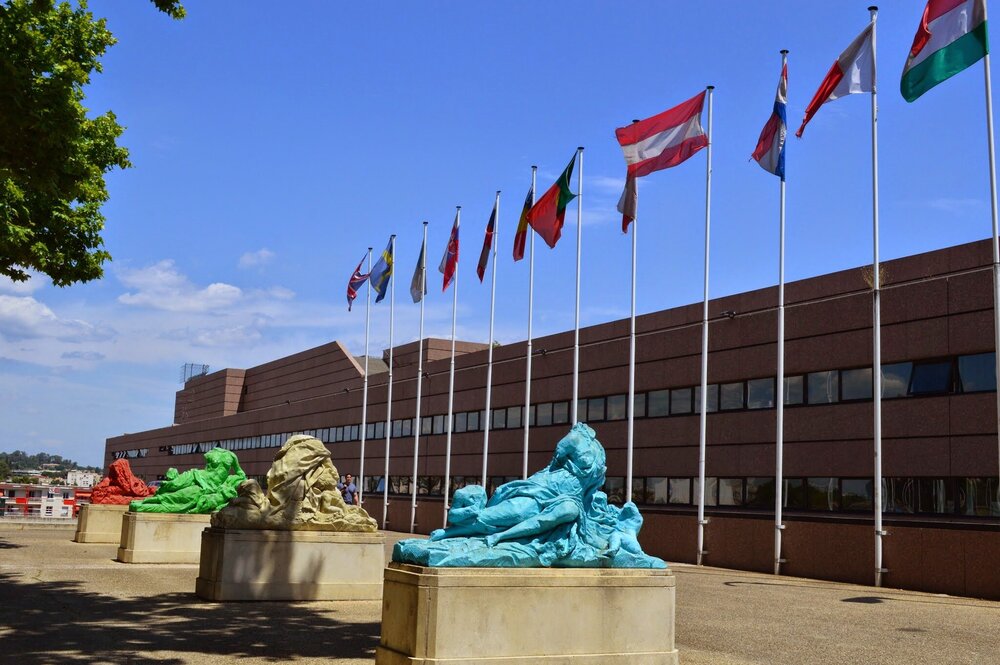 There is an outdoor sculpture exhibition in the park in front of Corum