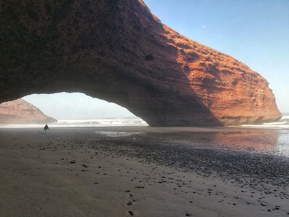 The arch in the rock is huge